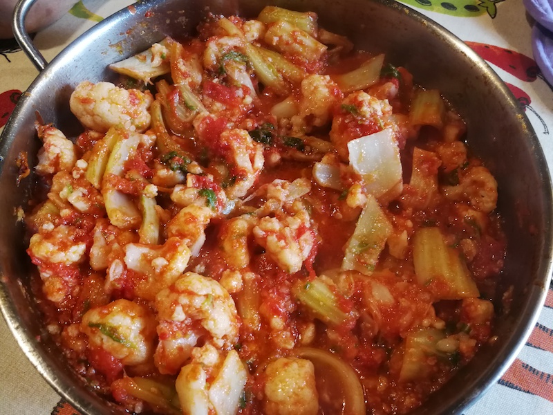 cauliflower cooking in tomato sauce